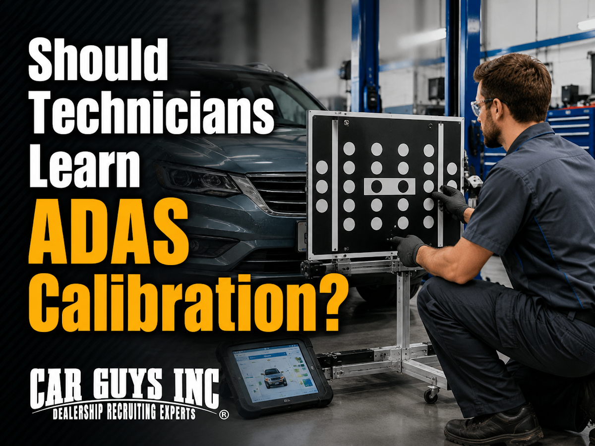 Technician setting up target boards for static ADAS calibration in a service bay