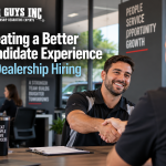 A candidate shaking hands with a dealership manager after an interview.