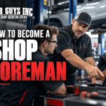 A shop foreman teaching diagnostics to auto technicians.