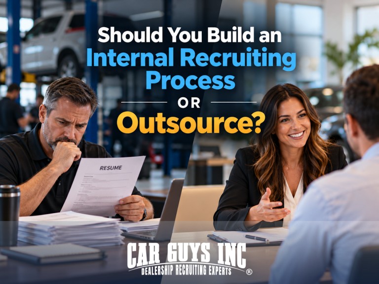 Two car dealership managers, one reviewing resumes and the other interviewing a candidate.