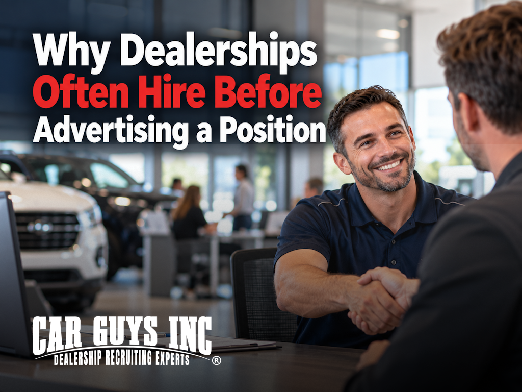A new car dealership employee shaking hands with his manager on his first day on the job.